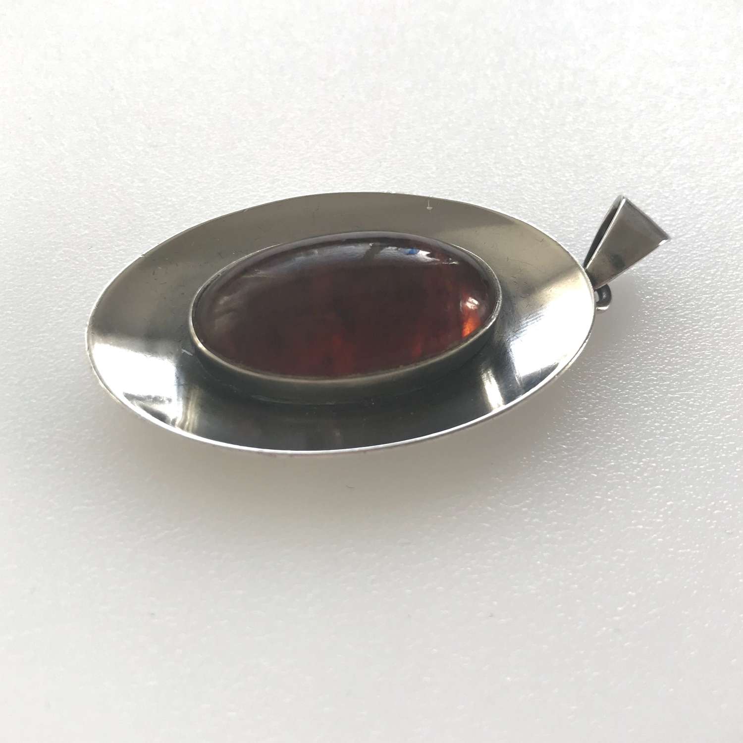 Niels Erik From silver pendant with amber cabochon, Denmark c 1960s