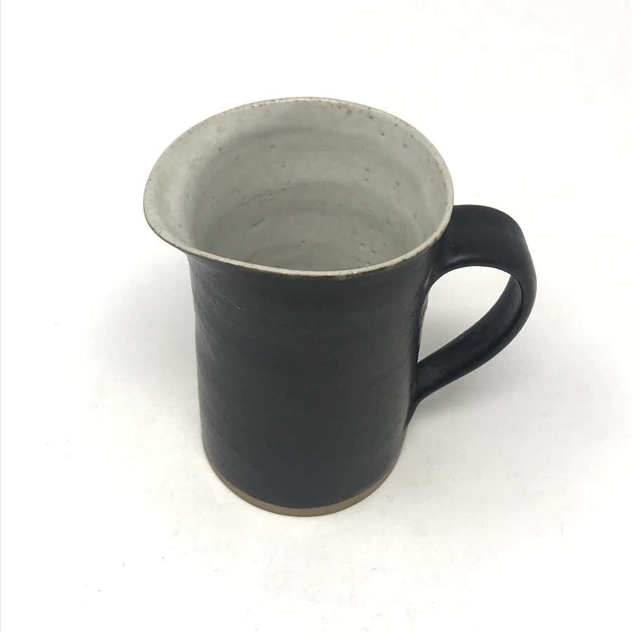 Lucie Rie stoneware jug in manganese and white England 1950s